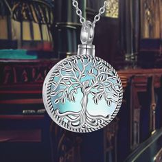 The Tree of Life represents eternal life, growth, and strength, making it a powerful symbol of remembrance. Its deep-rooted connection with immortality and the cycles of life adds significant meaning to the piece. The moonstone embedded in the necklace adds a touch of charm and mystery, symbolizing new beginnings, emotional balance, and inner clarity. The urn is designed with a screw closure at the top, allowing you to securely store a small amount of ashes or other meaningful mementos like perf Silver Remembrance Round Pendant Jewelry, Spiritual Oval Pendant Jewelry For Commemoration, Spiritual Locket Necklace For Memorials, Spiritual Round Pendant Necklace For Commemoration, Spiritual Commemoration Necklace With Round Pendant, Symbolic Medallion Jewelry For Memorial, Spiritual Nickel-free Necklaces For Memorial, Spiritual Pendant Necklace For Memorial, Healing Tree Of Life Round Jewelry