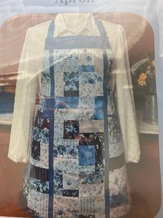 an apron made out of patchwork material on display