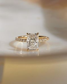 an engagement ring with a princess cut diamond