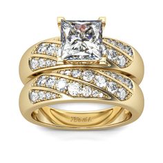 a gold ring set with a princess cut diamond and two rows of diamonds on the band