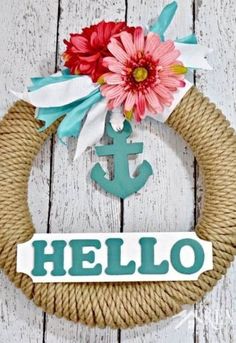 a rope wreath with an anchor and flower on it that says hello written in the center