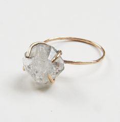 Haute Herkimer Diamond Ring: Mirrored reflections shine on the sharp surface of each Herkimer Diamond stone.   My natural herkimer stones are as ethically sourced and as raw and unadulterated as possible. Set in 14k gold filled prongs, to emphasize the natural crystal shape. Herkimer Diamond stones grow naturally in this double terminated shape, which explains why they are confused for diamonds.  These beautiful stones have for an extra sparkle and shine and will pair nicely with your favorite outfit. The beautiful ring make a perfect Engagement ring or Anniversary Gift.  - Raw Herkimer Diamond stone, approximately 10mm - - Available in Recycled 14 Karat Gold Fill or Sterling Silver - Handmade to order in my California studio. - Please allow for natural variation in crystals in shape, clar Raw Diamond Ring, Herkimer Diamond Ring, Raw Crystal Ring, Etsy Gold Ring, Epilator, Gold Filled Ring, Raw Diamond, Herkimer Diamond, Gold Diamond Rings