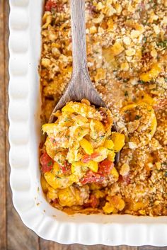 a casserole dish with a spoon in it