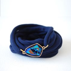 "This simple wrap bracelet, in the colour of your choice with a fake blue crystal connector is a simple way to make a statement or to cover a small wrist tattoo. This 'wrap around your wrist' bracelet is made out of an elastic fabric which will fit mosts wrists.  This is a listing for ONE fake blue crystal Wrap bracelet. Width of Cuff: approx. 2.1\" Wrist cuff best washed by hand in cold or warm water with a mild soap. Squeeze gently to remove excess water before drying flat in order to obtain the original shape. Please note that the color might slightly vary based on your monitor settings. For other matching accessories: https://www.etsy.com/shop/Gypsoulstudio?ref=seller-platform-mcnav" Small Wrist Tattoo, Cristal Bracelet, Crystal Wrap, Wrap Armband, Small Wrist Tattoos, Wrist Bracelet, Wrist Tattoo, Tattoo Cover, Bracelet Fashion