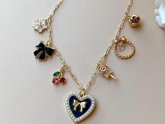 Please Read   Photos are enlarged to show detail. Please read the measurement in the description.  DETAILS:  ☑️ The chain is 14kt heavy Gold plated. ☑️ The charms are heavy gold plated. ♥️ Follow us and like us on Instagram for discount codes and new designs @mathewandmarieco Vintage Heart-shaped Charms Necklace, Red Heart-shaped Charm Necklace, Vintage Brass Heart Charm Necklace, Gold-tone Charm Necklaces For Valentine's Day, Yellow Gold Tarnish-resistant Charm Necklace For Valentine's Day, Fun Diy Crafts, Black Heart, Fun Diys, Charm Necklace