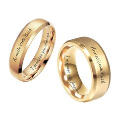 two gold wedding rings with names engraved on the inside and outside, one is for him and