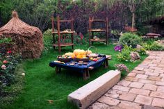 a table with food on it in the middle of a garden