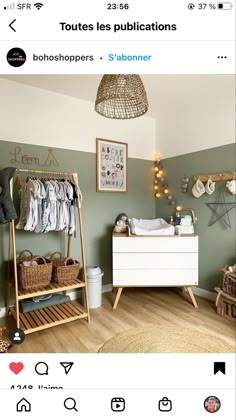 a baby's room with green walls and white furniture, including a crib