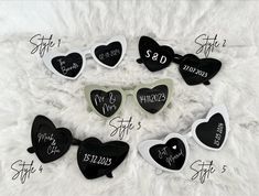 six heart shaped sunglasses with names and date on the side, all in black and white