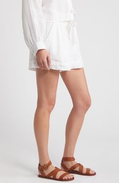 These staple shorts are crafted from crisp linen for laid-back yet polished look and feel. 3" inseam; 31" leg opening; 13" front rise; 16" back rise (size medium) Drawstring waist Side-seam pockets 100% linen Dry clean Imported Chic White Relaxed Fit Bermuda Shorts, Linen Bottoms With Built-in Shorts, White High-waisted Linen Bermuda Shorts, White Relaxed Fit Linen Bottoms, White Relaxed Fit Bermuda Shorts For Spring, Linen Bottoms For Daywear With Short Length, Linen Bottoms For Daywear, Linen Shorts For Daywear, High-waisted Linen Shorts For Daywear