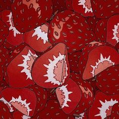 a pile of strawberries with maple leaf designs on them, all in red and white