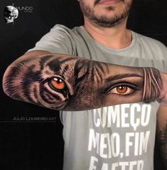 a man with an arm tattoo that has a tiger's eye and the words ummego meo film eater on it