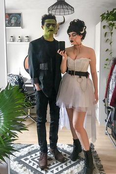 a man and woman dressed up in costumes