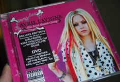 the cd cover for avril lavinne is being held up by someone's hand