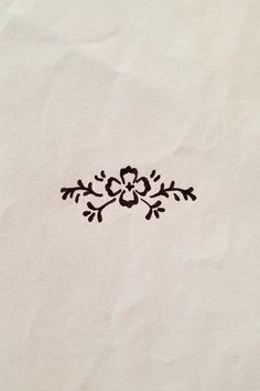 a piece of paper with a flower drawn on it