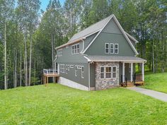 a house in the woods surrounded by trees