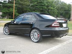 a black car parked in a parking lot