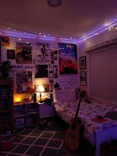 a bed room with a guitar sitting on top of it