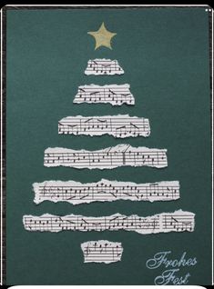 a christmas tree made out of sheet music paper with gold star on top and green background