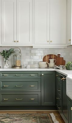 a kitchen with green cabinets and white counter tops is pictured in this image from the front view