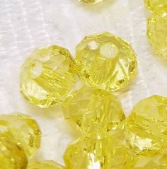 some yellow crystals are laying on a white cloth