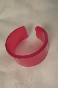 "Measuring 1-5/16\" wide, this beautiful bangle is colored in bright lipstick red Lucite which is just stunning! The inside diameter measures 2-5/8\" and the opening has some slight give to it for easy on and off. This is a very fine piece and it is in excellent vintage condition!" Bright Lipstick, Lucite Bracelets, Lipstick Red, Cuff Bangle Bracelet, Red Jewelry, Cuff Bangles, Arm Band, Cuff Bracelets, Bangle Bracelets