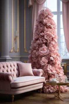 a living room with a couch and a pink christmas tree in the middle of it