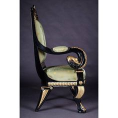 an antique chair with black and gold trimmings