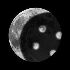 the moon is shown in black and white with small dots on it's surface