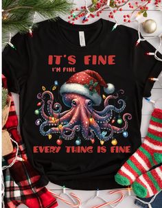 CHRISTMAS INTROVERT SHIRT - It's Fine I'm Fine Everything is Fine Shirt, Christmas Octopus Shirt, Motivational Tee, Everything is Fine Shirt Celebrate the holiday season with a touch of introverted humor and a splash of festive flair in our Christmas Introvert Shirt. Perfect for those who appreciate a bit of motivation with their Christmas cheer, this tee is both comfy and stylish! Key Features: Material: 100% cotton for a soft, breathable wear. Variations include: Sport Grey: 90% cotton, 10% polyester Ash Grey: 99% cotton, 1% polyester Heather colors: 50% cotton, 50% polyester Fabric Weight: 5.0-5.3 oz/yd² (170-180 g/m providing a sturdy and comfortable fit. Design: Features a quirky "It's Fine I'm Fine Everything is Fine" message with a playful Christmas octopus graphic, adding a humorou Christmas Octopus, Octopus Graphic, I'm Fine, Everything Is Fine, Holiday Wardrobe, Christmas Cheer, Christmas Shirts, Funny Gifts, The Holiday