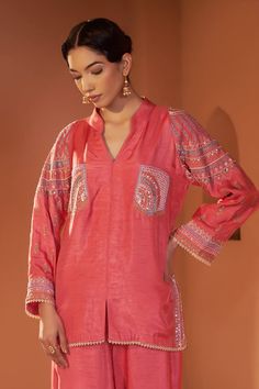 Red shirt style tunic with placement embroidery using dori, sequin, beads. Paired with a palazzo with embroidered hem. - Aza Fashions Long Sleeve Blouse With Dabka Work For Festive Occasions, Eid Long Sleeve Blouse With Embroidered Sleeves, Embroidered V-neck Designer Wear Tops, Embroidered V-neck Top For Designer Wear, Festive Eid Straight Kurta Top, Embroidered V-neck Designer Tops, Festive V-neck Top With Resham Embroidery, Festive Long Sleeve Tops With Resham Embroidery, Embellished Long Sleeve Blouse For Eid