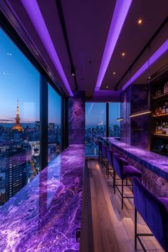 a bar with purple lighting and chairs overlooking the city