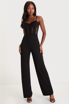 The Lulus Perfectly Sultry Black Sheer Mesh Bustier Wide-Leg Jumpsuit is ready to help you create a look that is flawlessly flirty! This alluring jumpsuit starts with sheer mesh fabric that shapes a sweetheart neckline and a bustier-inspired bodice with padded cups, corset-style seams, and floral lace accents throughout, all supported by adjustable spaghetti straps. The high, banded waist tops wide pant legs (composed of stretchy crepe knit) that fall to ankle-length hems. Hidden back zipper/clasp. Fit: This garment fits true to size. Length: Floor length. Size medium measures 53" from adjustable straps to hem. Inseam: 32.25 Front Rise: 11.50 Bust: Great for any cup size. Waist: Fitted - very fitted at natural waist. Hip: Fitted - stretchy fabric allows room for hips. Undergarments: Padded Corset Jumpsuit Outfit, Bustier Top Outfits, Bustier Outfit, Corset Jumpsuit, Black Bustier Top, Lulus Jumpsuit, Black Lace Corset Top, Big Dress, Black Lace Jumpsuit