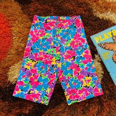 Vintage deadstock 1990's vibrant floral biker shorts.  Fit like an XS although they are labeled as a medium. Run small.  90% cotton 10% Lycra Unworn vintage condition with original tags. Have several pairs available if you would like to match with friends Stretch Multicolor Floral Print Shorts, Multicolor Stretch Floral Print Shorts, Multicolor Biker Shorts For Spring, Spring Multicolor Biker Shorts, Multicolor Short Length Biker Shorts For Spring, Spring Stretch Multicolor Biker Shorts, Biker Shorts Fit, Shorts Fit, Mode Vintage