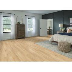 a bedroom with hardwood floors and blue walls