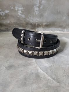 Pyramid Studded Leather Punk Belt Made to Order 2-3 Weeks This is a must have for those of you who refuse to give up wearing a studded leather belt. I still can't wear a plain leather belt, it has to be covered in studs. I actually made this belt for myself, but It would be rude not to share, so here it is. It is made with brushed satin pyramid studs (nickel plated brass). There is a combination of cow leather for strength and soft goat leather surrounding the pyramid studs, complimented with st Black Punk Belt With Rivets, Edgy Adjustable Belts With Rivets, Edgy Adjustable Belt With Rivets, Punk Belt, Leather Bra, Goat Leather, Studded Leather, Leather Gloves, Pyramid