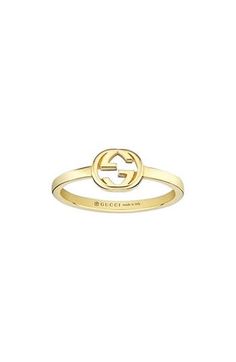 The recognizable GG-logo centers this 18-karat-gold ring that's perfect for stacking. 1/4" pendent; 1/8" band 18k gold Made in Italy Gucci Ring Gold, Modern Gucci Rings For Anniversary, Designer Yellow Gold Anniversary Rings, Designer Yellow Gold Rings For Anniversary, Gucci Gold 14k Gold Rings, Gucci 14k Gold Rings, Luxury Gucci 14k Gold Rings, Gucci 14k Gold Rings For Formal Occasions, Classic Gucci Yellow Gold Ring