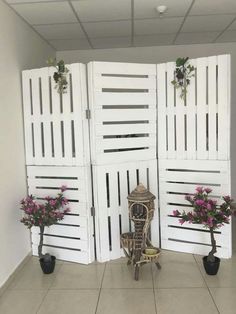 three white doors with flowers on each side