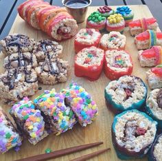 there are many different types of donuts on the table with sprinkles