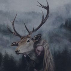 a painting of a woman hugging a deer with antlers on it's head