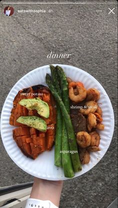 a paper plate with shrimp, asparagus and sweet potato on it that says dinner