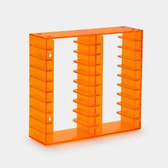 an orange shelf with several shelves on each side