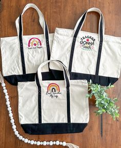 "This large heavy duty canvas tote bag is 21\"x15\" with black straps and a 6.5\" wide pocket on the front. It also had a zipper and a smaller pocket with a zipper inside. It is the perfect size to carry all of your teacher things in it!! There are 3 different options to choose from: Teach, Love, & Inspire Teachers Gonna Teach Best Teacher Personalization is also available for an extra charge. Design may be a tad smaller to be able to fit teacher's name. If you choose personalization, please lea Black Cotton Canvas School Bag, Embroidered School Tote Canvas Bag, Black Embroidered Canvas Tote Bag, Teacher Tote Bag, Teach Love Inspire, Teacher Tote, Teacher Things, Personalized Teacher Gifts, Zipper Tote Bag