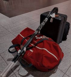 two pieces of luggage sitting on the ground