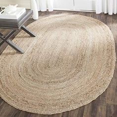 a large round rug on the floor in a living room