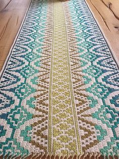 a table runner on top of a wooden floor