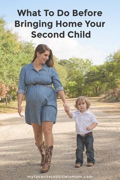 a woman holding the hand of a small child while walking down a road with text overlay how to practice mindfulness as a busy mom