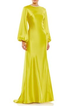 A bedazzled jewel neck stands out against falling folds of satin on a balloon-sleeve sheath gown that's gloriously gasp-worthy. 63" length Jewel neck Long sleeves Lined 100% polyester Spot clean Imported Chartreuse Evening Dress, Mac Duggal Dress, Glamorous Dress, Satin Evening Gown, Evening Gowns With Sleeves, Sheath Gown, Mac Duggal Dresses, Trumpet Gown, Column Gown