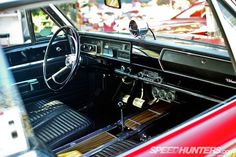 the interior of an old car is clean and ready to be used as a showroom