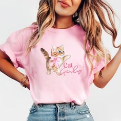 Embrace elegance and flirtatious charm with our captivating cat in a pink bow shirt, a delightful addition to your coquette-inspired wardrobe! 🌸👚 This shirt embodies the essence of femininity and playfulness, perfect for those who adore a touch of chic sophistication with a hint of flirtation. 🌷 The darling pink hue complements the shirt's design, accentuating the focal point--an exquisitely crafted oversized bow adorning the neckline or sleeves, adding a whimsical and flirtatious allure to y Boho Ribbon, Coquette Cat, Bow Shirt, Coquette Style, Ribbon Shirt, Feminine Fashion, Bow Shirts, Girls Bows, Colorful Boho